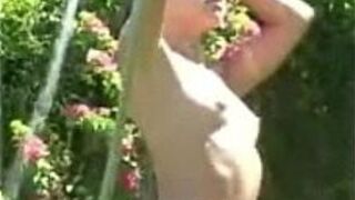 Sissy with the garden hose in the back yard - porn video